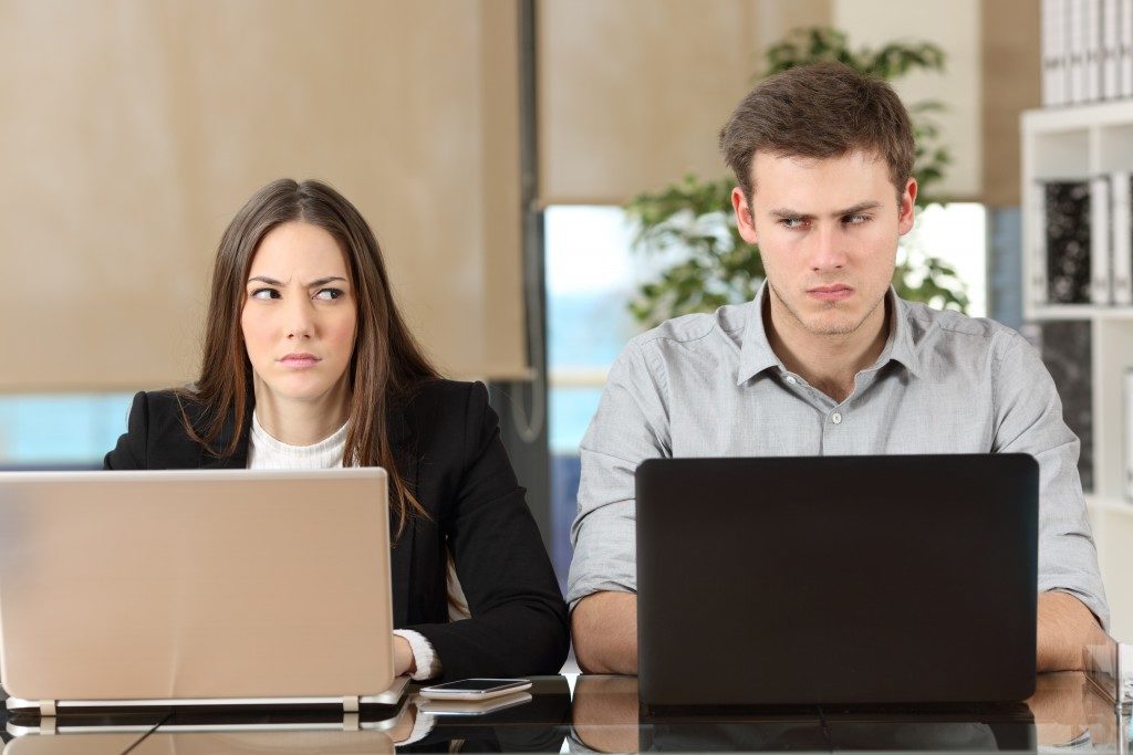workmates annoyed with each other