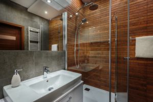 modern bathroom with wood and grey tiles