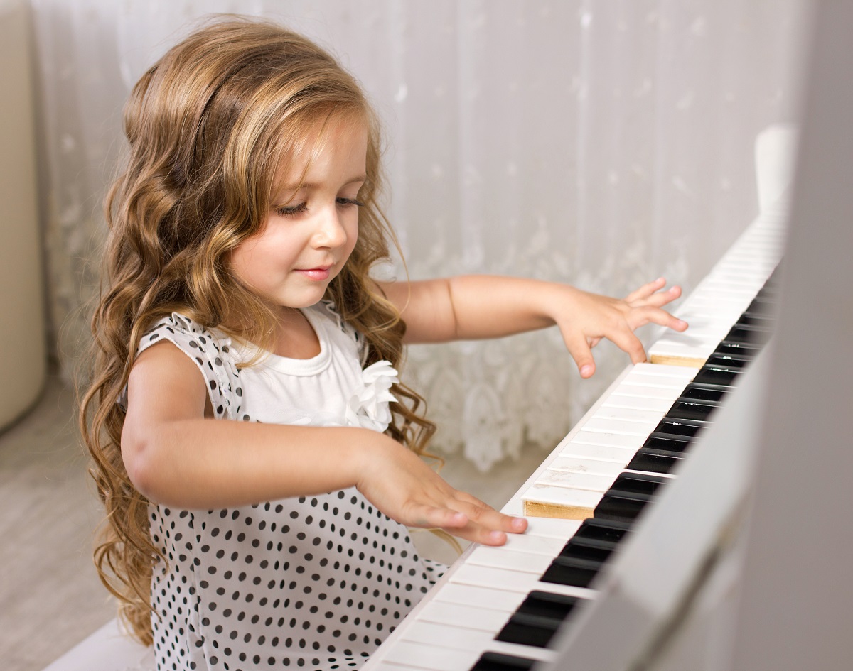 young girl playing piano