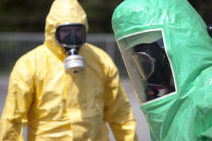 Two men wearing protective gear for pandemic