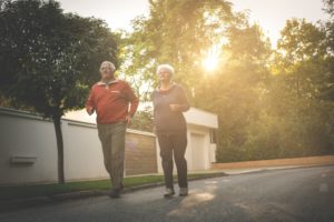 elderly couple jogging