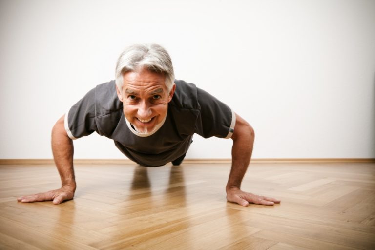 senior doing push ups