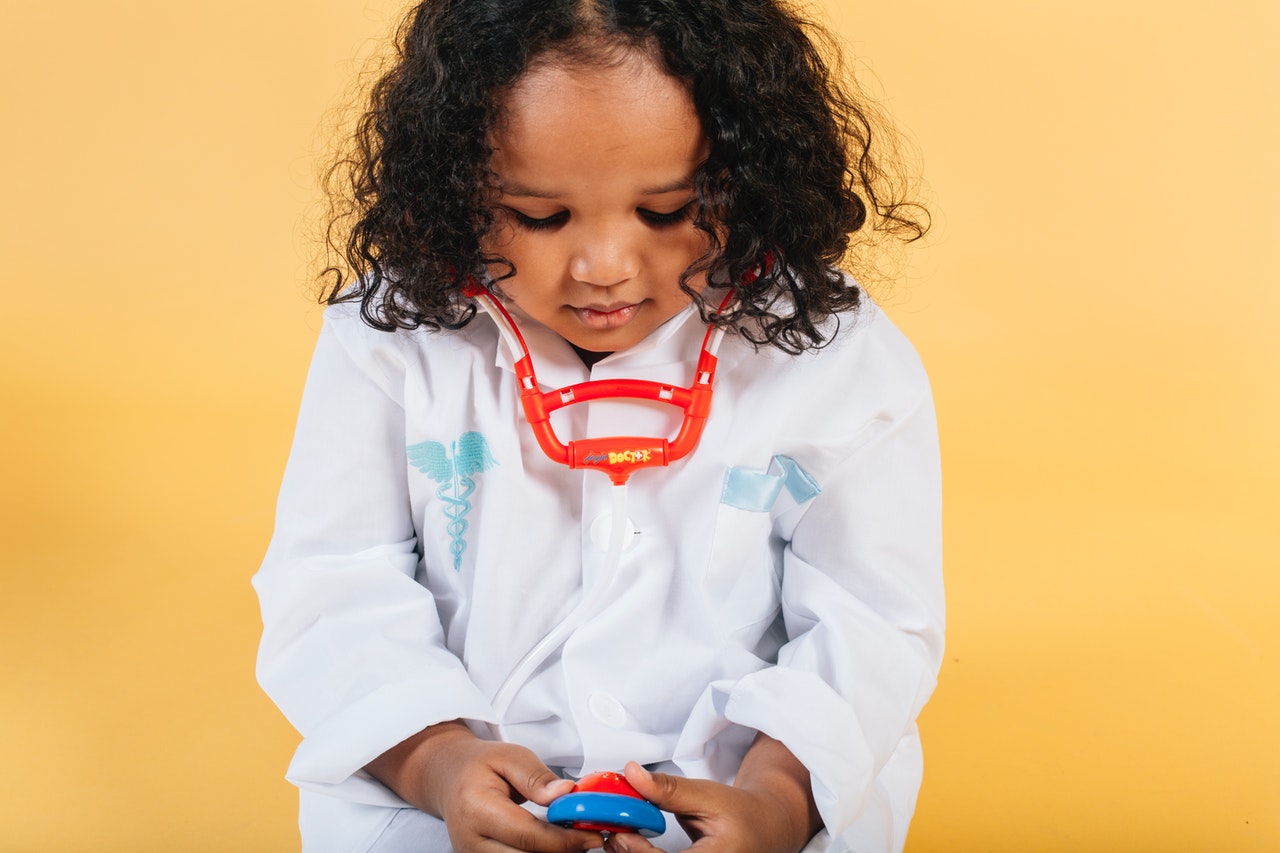 child with toy stethoscope