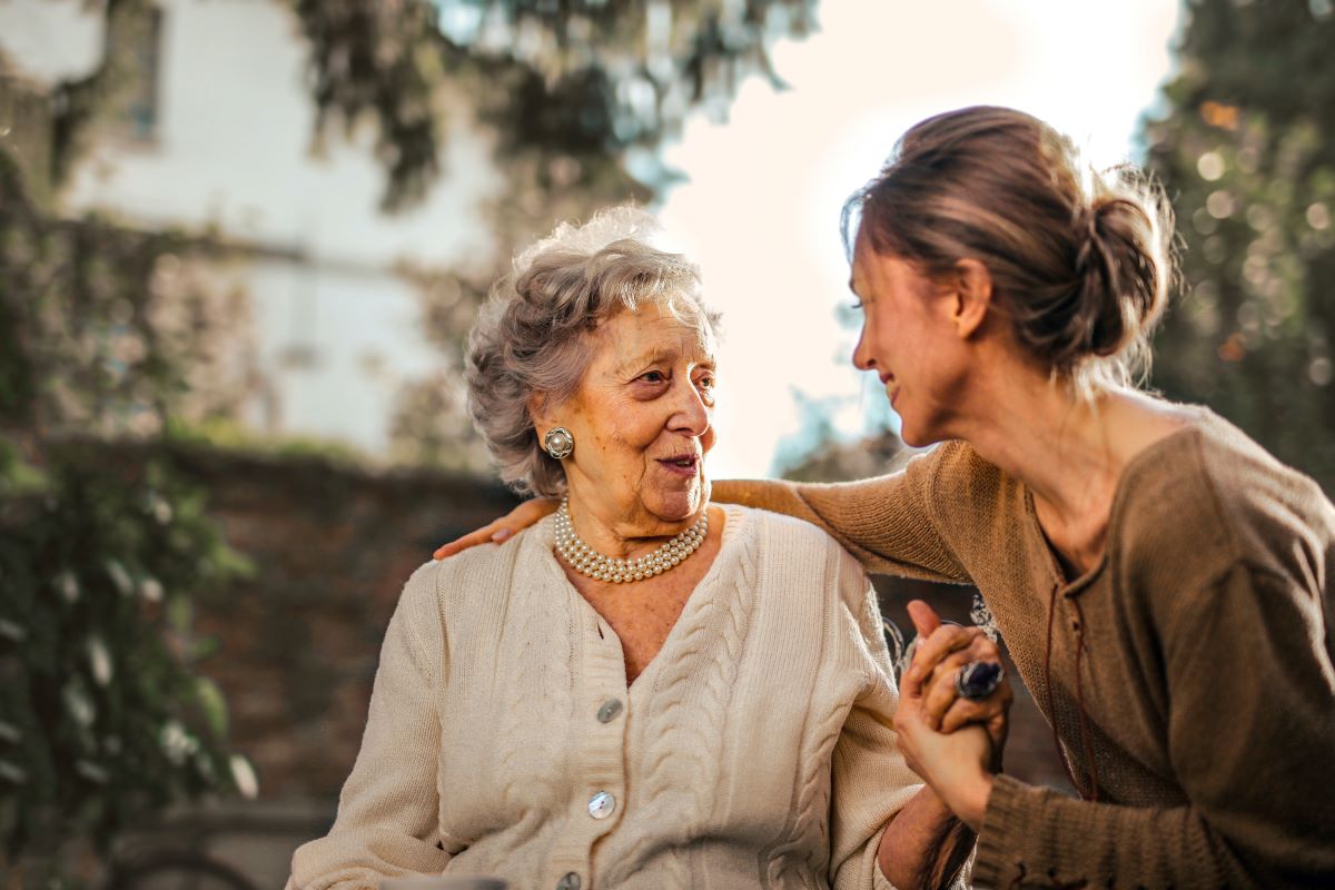 woman talking to elder