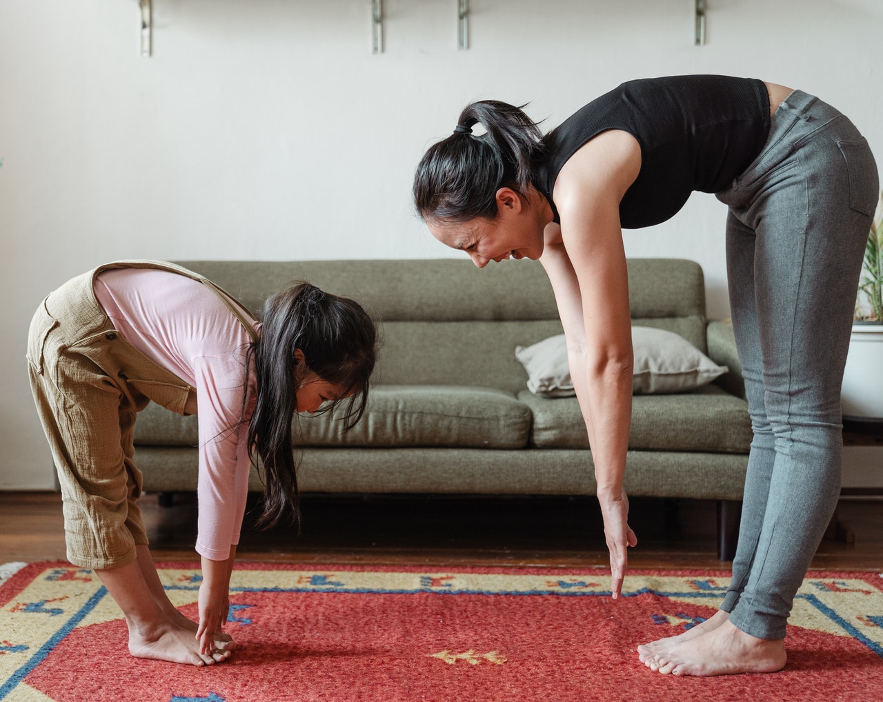 mother and daughter doing some stretching