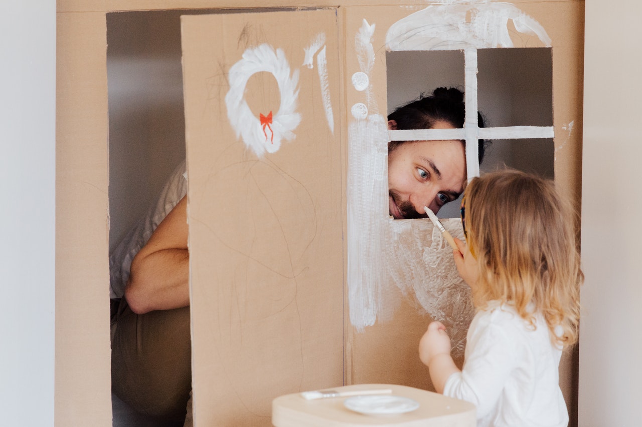 father playing with his daughter