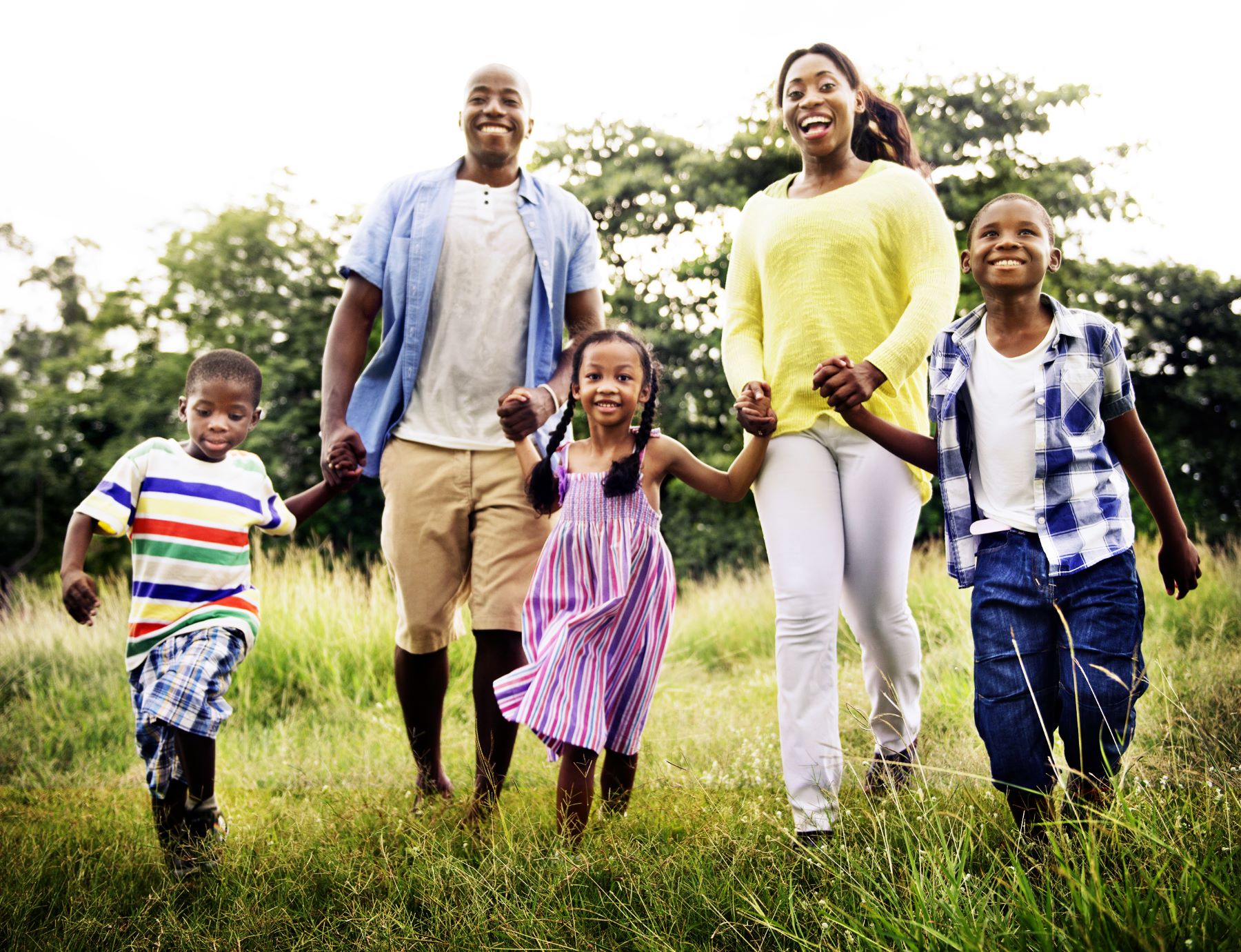 family holding hands outdoors