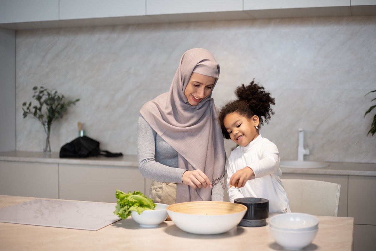 mother and daughter cooking