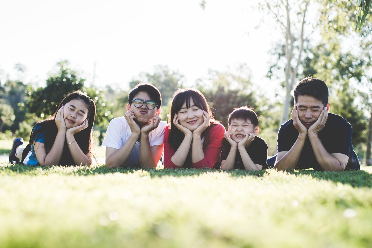 family lying on the ground