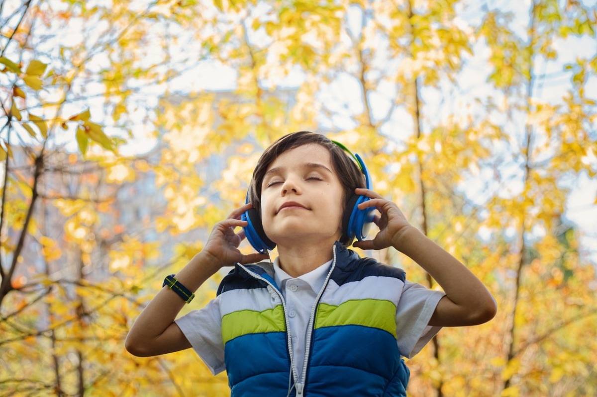 child listening to music