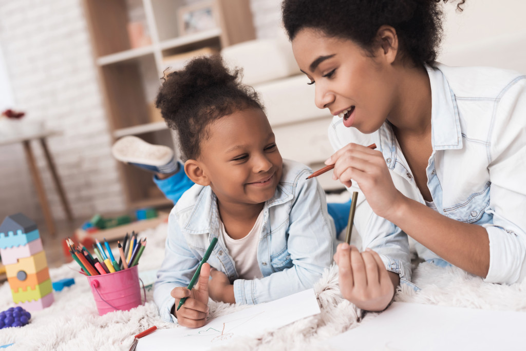 A woman tutoring a child