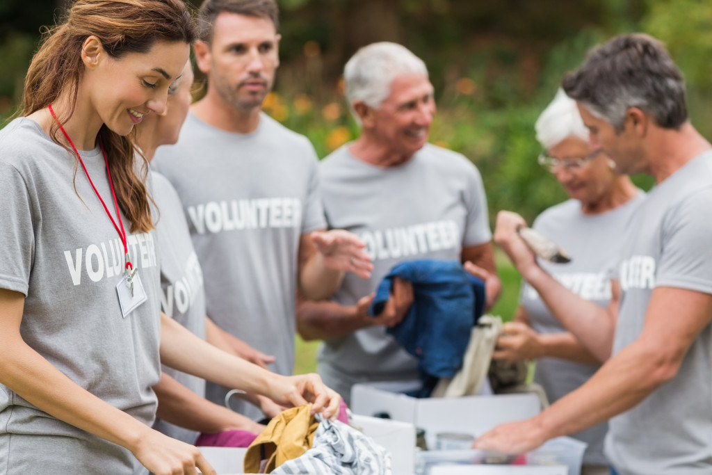 a family wearing volunteer shirt