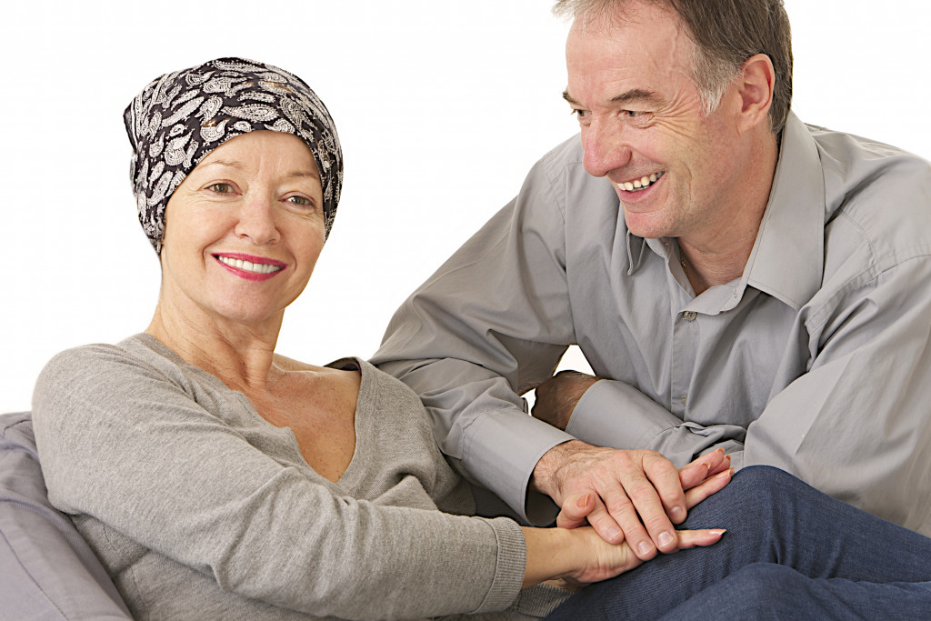 A supportive husband looking at his wife with cancer