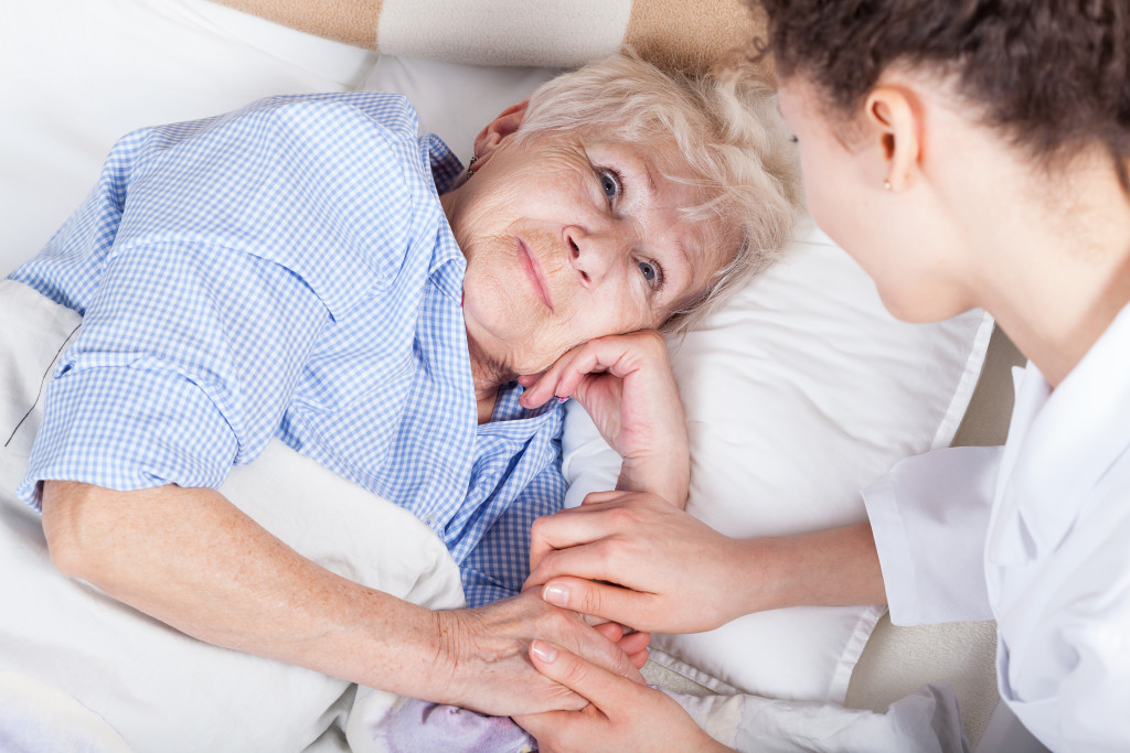 elderly woman with her nurse