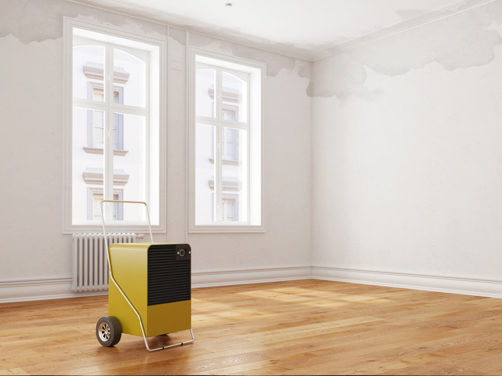 An industrial dehumidifier at the center of a home