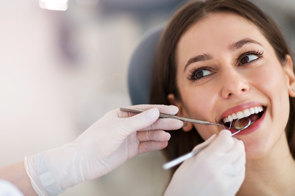 A woman having her teeth checked