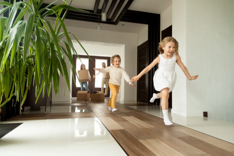 young family with boy and girl running