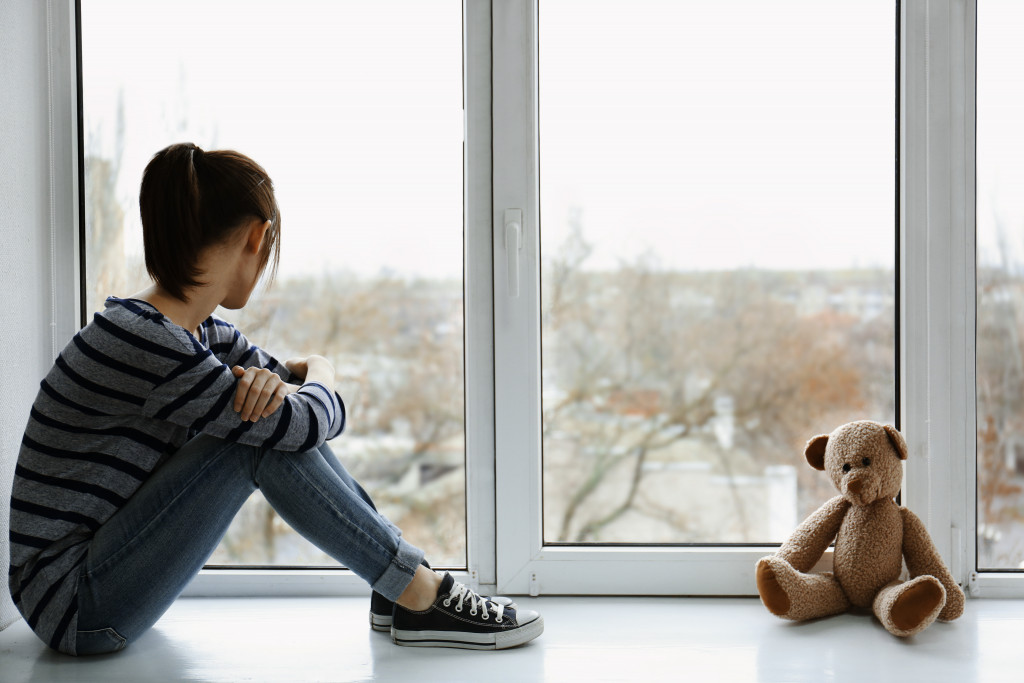 teen girl in her room alone