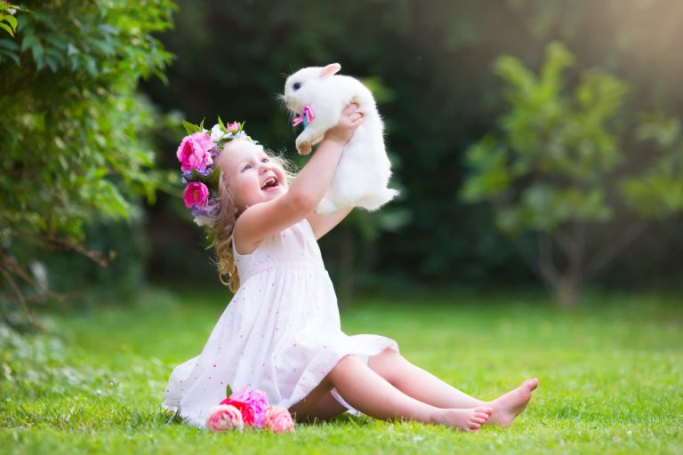 child holding a pet