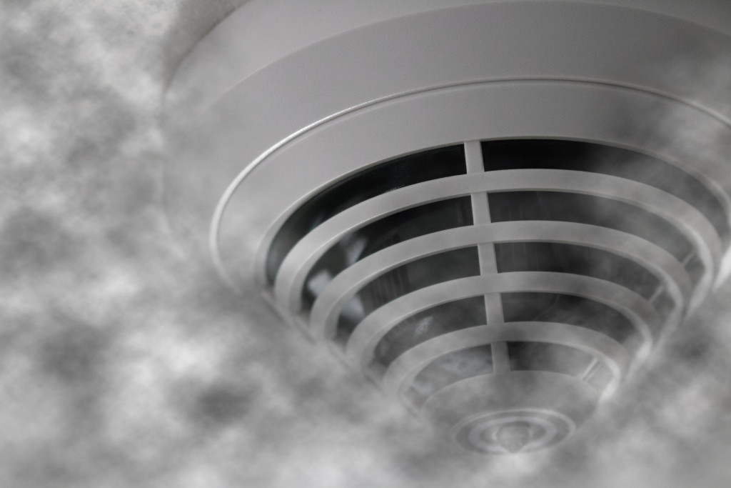 A smoke detector surrounded by smoke