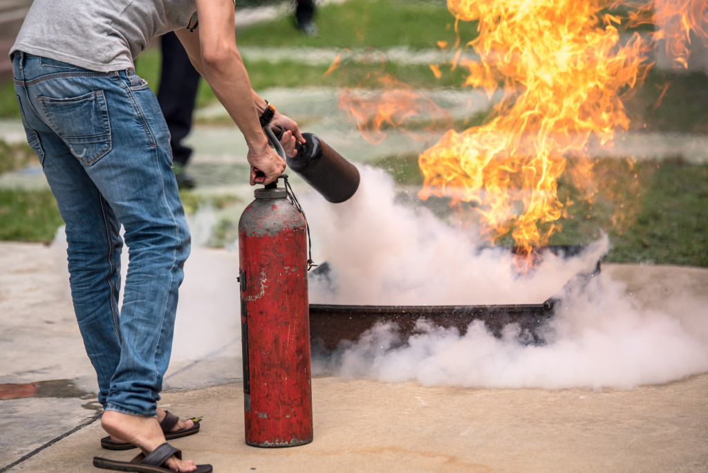 using a fire extinguisher