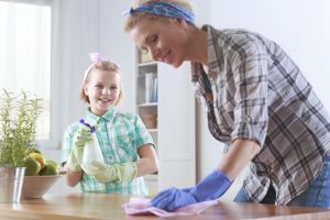 mother and daughter cleaning the home