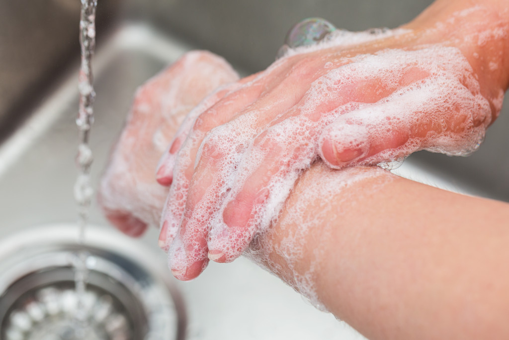 Washing hands in the sink