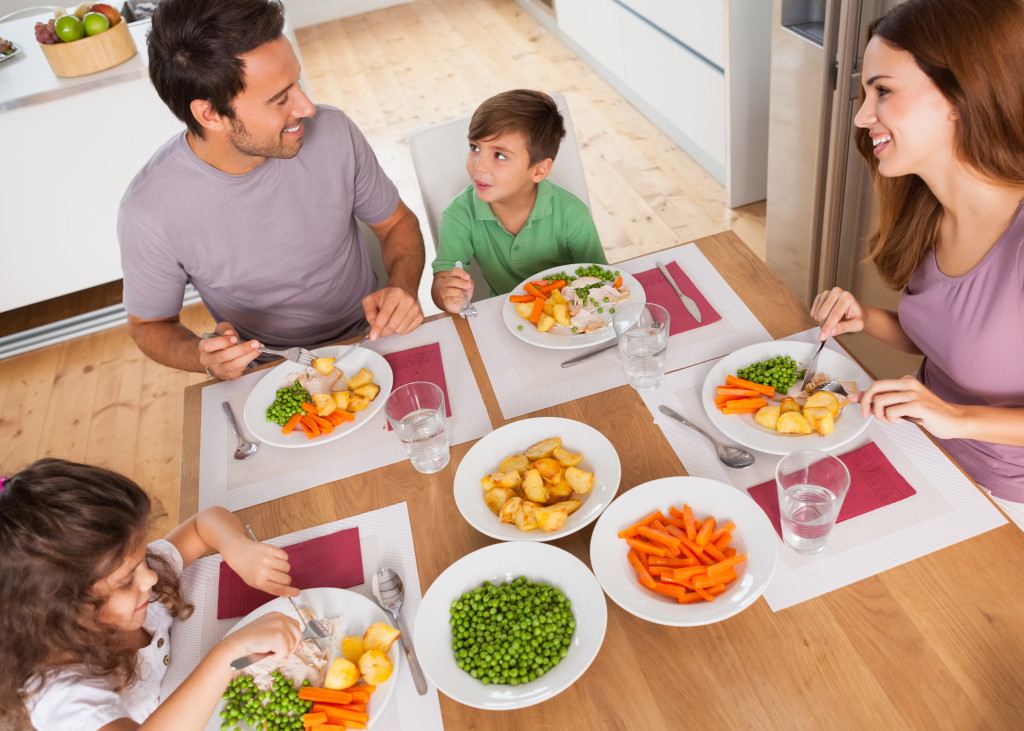 a happy family having a meal