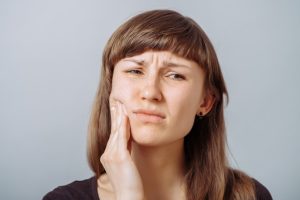 woman having oral pain