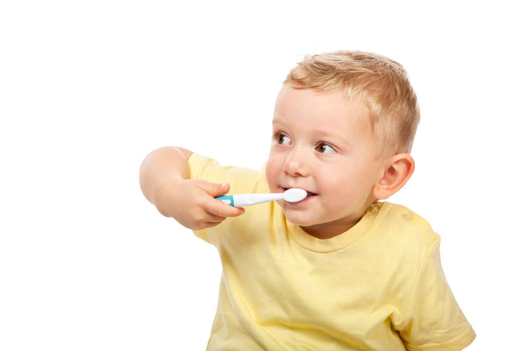 Child brushing teeth at home