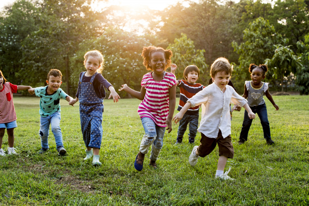 happy playing kids that are not fighting in the field