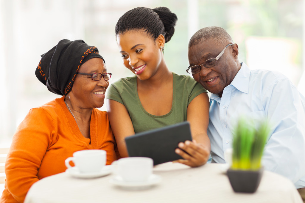 daughter checking her elderly parents' needs