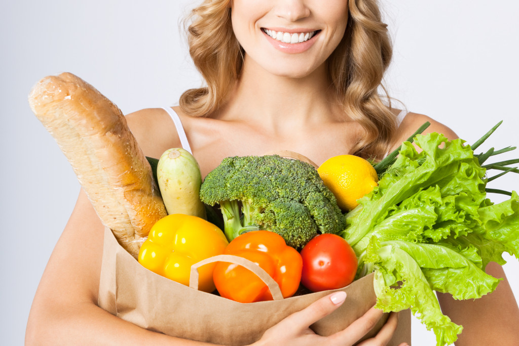 woman with bag full of foods