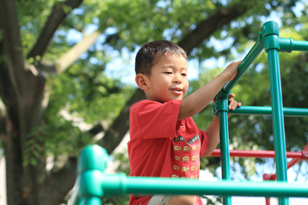a child playing at the playground