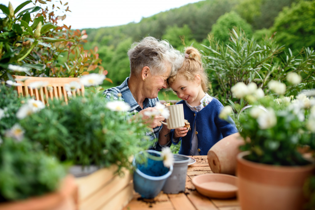 Child in garden and her mom