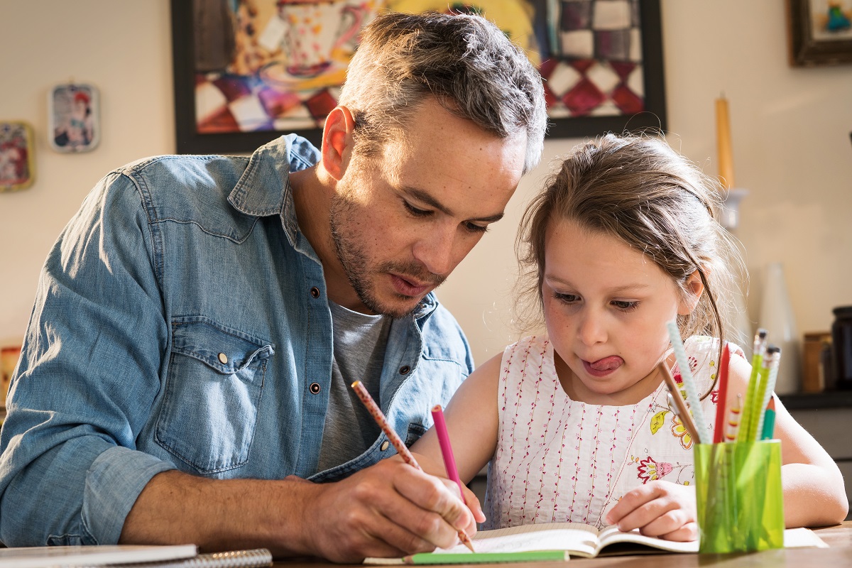 dad helping daughter with lessons